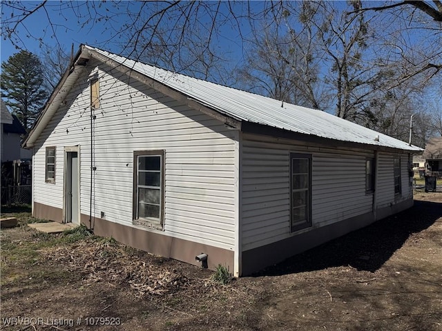 view of home's exterior with metal roof