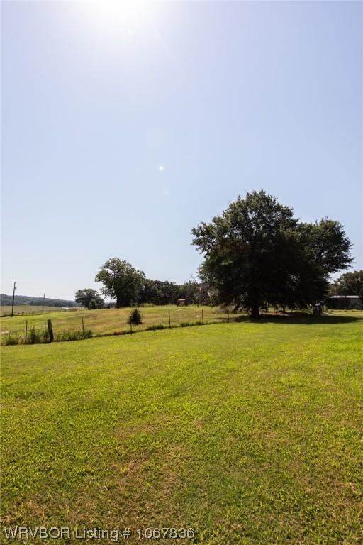 view of yard with a rural view