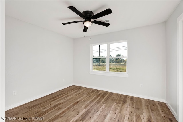 spare room featuring ceiling fan and hardwood / wood-style floors