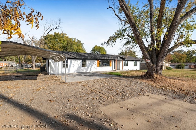 ranch-style house with a carport