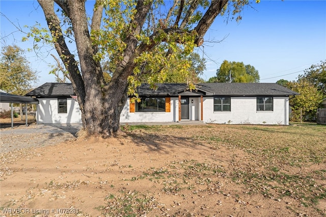 view of front of house featuring a carport