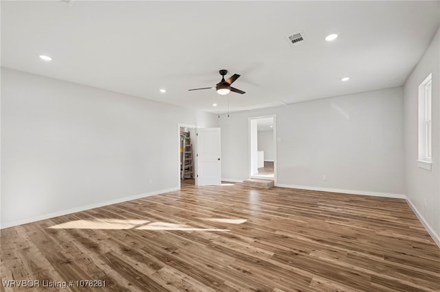 empty room with wood-type flooring and ceiling fan