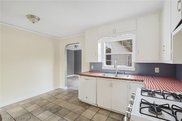 kitchen with white cabinetry, white appliances, arched walkways, and a sink