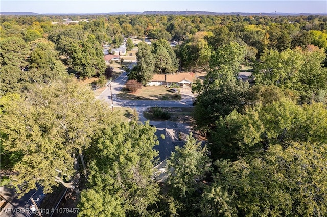 drone / aerial view featuring a view of trees