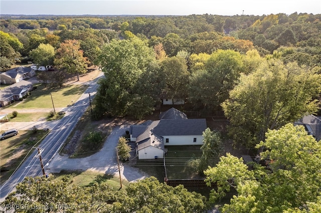 drone / aerial view featuring a forest view