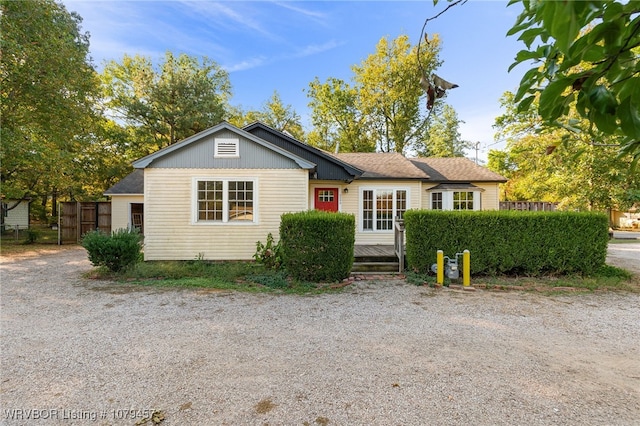 ranch-style home with fence