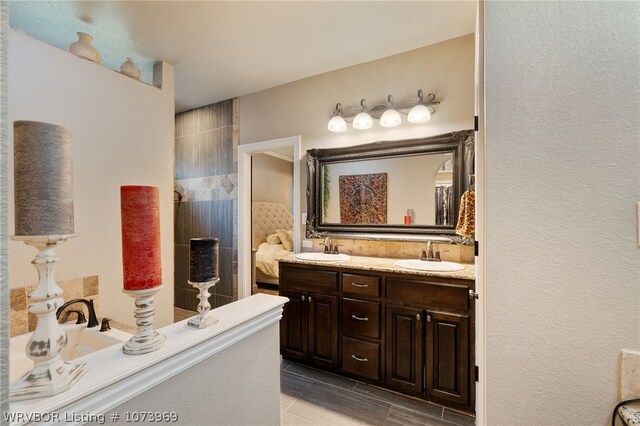 bathroom featuring tile patterned flooring and vanity