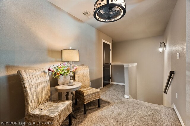 sitting room with carpet floors