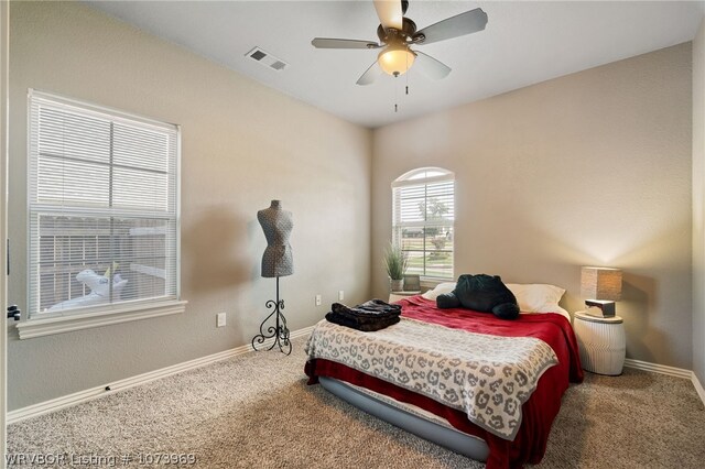 carpeted bedroom with ceiling fan