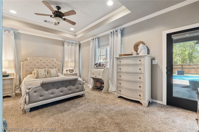 bedroom featuring carpet, access to outside, ceiling fan, and a tray ceiling