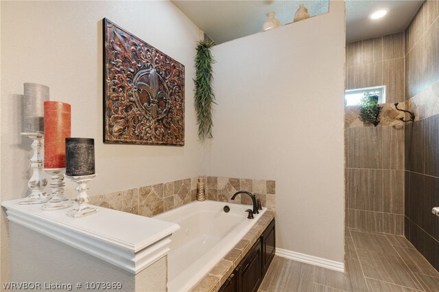 bathroom with tiled tub