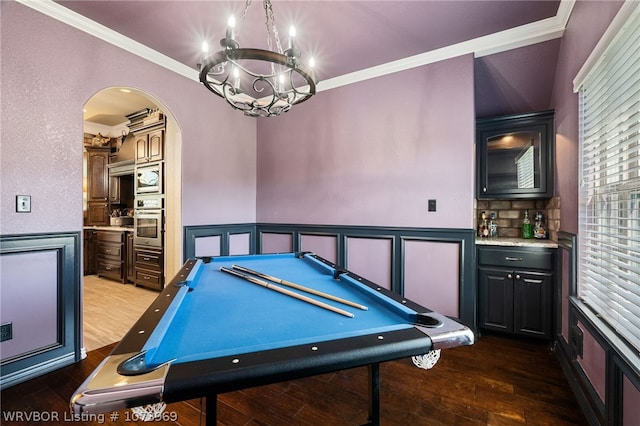 rec room featuring dark wood-type flooring, crown molding, and pool table