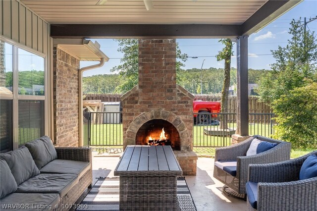 view of patio / terrace with an outdoor brick fireplace