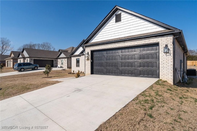 view of front of house with a garage, brick siding, driveway, and central air condition unit