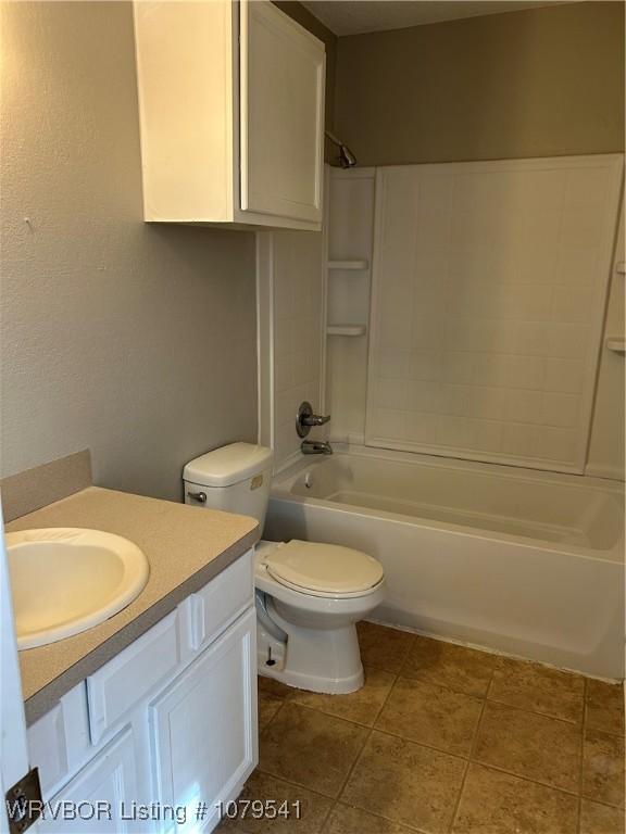 full bathroom with tile patterned floors, vanity, toilet, and shower / bathtub combination