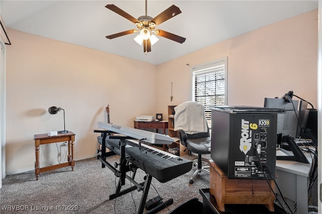 carpeted home office featuring ceiling fan and baseboards