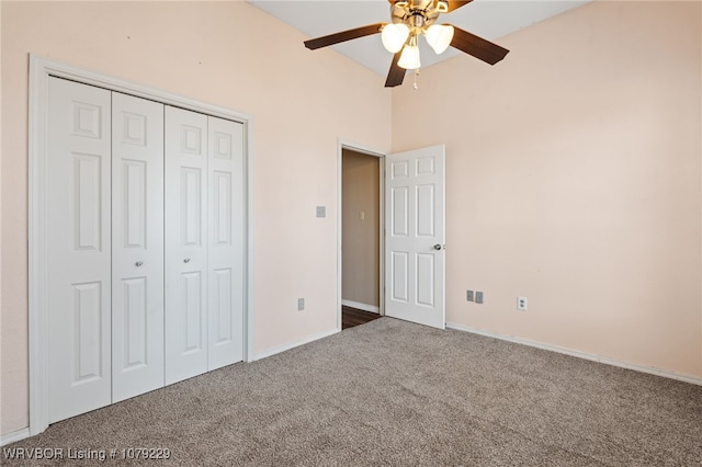 unfurnished bedroom with carpet, a closet, and ceiling fan