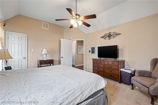 bedroom with lofted ceiling, visible vents, a ceiling fan, and light colored carpet