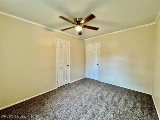 carpeted empty room with ceiling fan and ornamental molding