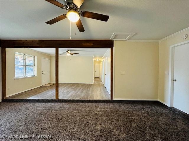 unfurnished bedroom with carpet, ceiling fan, and crown molding