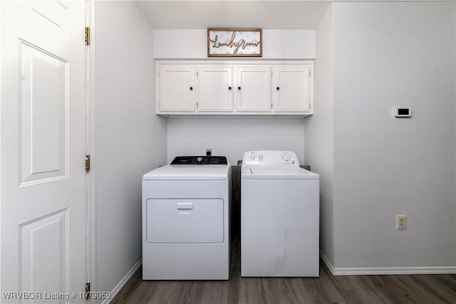 clothes washing area featuring cabinets, dark hardwood / wood-style floors, and separate washer and dryer