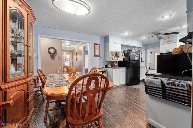 dining room with ceiling fan and a textured ceiling