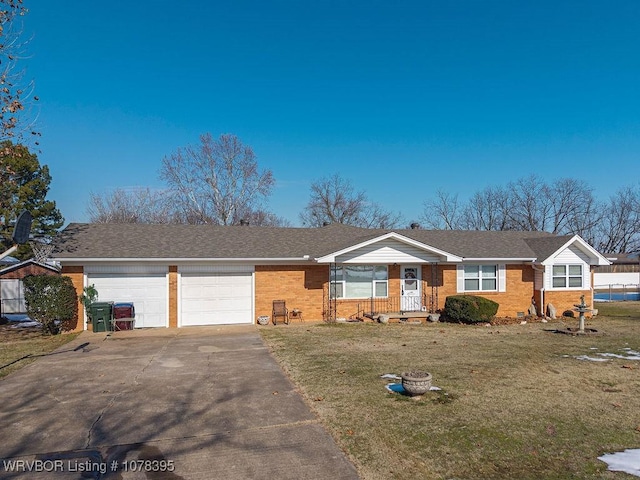 single story home with a garage and a front lawn