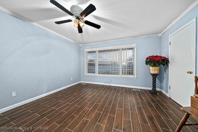 spare room with ceiling fan and crown molding