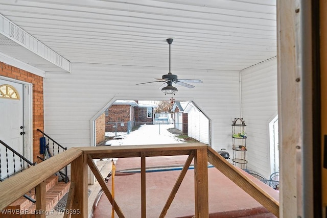 interior space with a healthy amount of sunlight and ceiling fan with notable chandelier