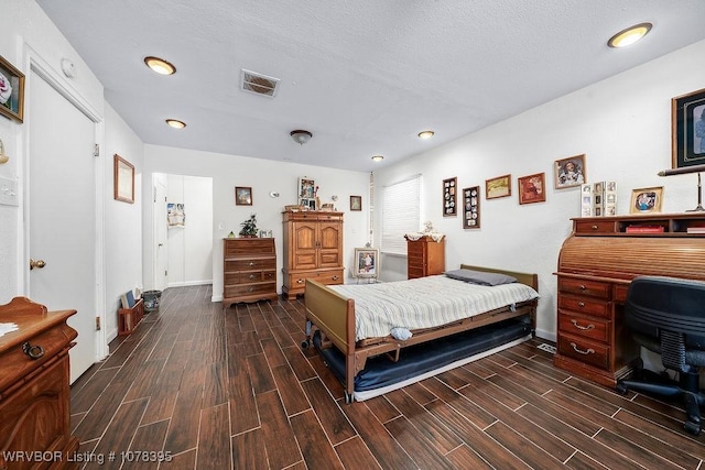 bedroom featuring a textured ceiling