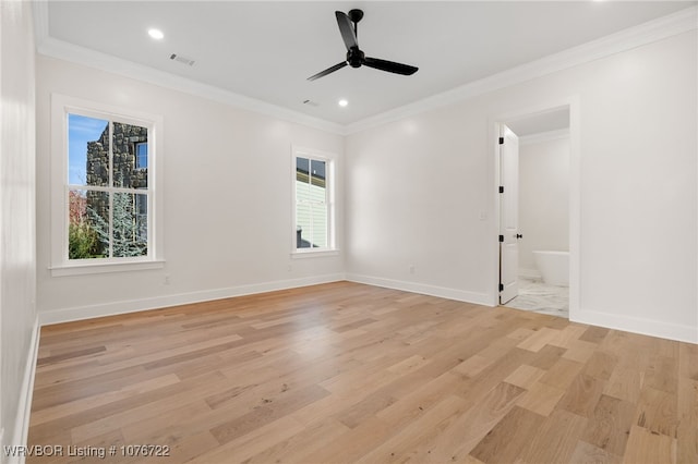 empty room featuring light hardwood / wood-style floors, ceiling fan, and ornamental molding