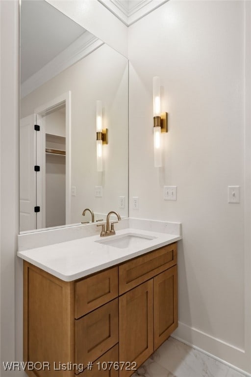 bathroom featuring vanity and ornamental molding