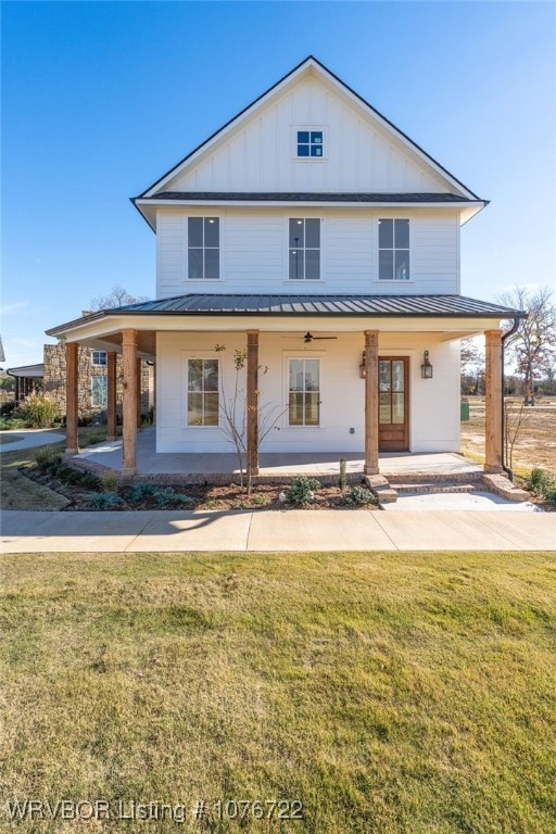 view of front facade featuring a porch and a front yard