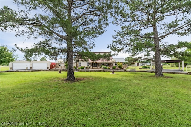 461510 E 1130th Rd, Sallisaw, OK 74955 - view of grassy yard featuring a garage