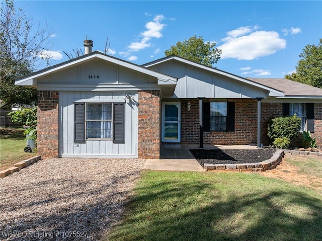 1414 12th Cir, Barling, AR 72923 - view of front of home featuring a front yard and brick siding