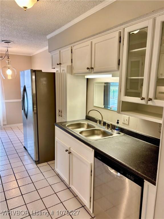 1414 12th Cir, Barling, AR 72923 - kitchen with appliances with stainless steel finishes, a textured ceiling, crown molding, white cabinets, and dark countertops