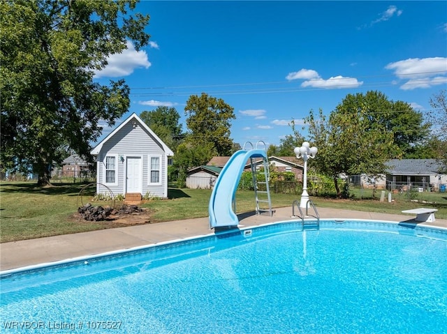 1414 12th Cir, Barling, AR 72923 - view of swimming pool featuring a water slide, an outbuilding, and a diving board