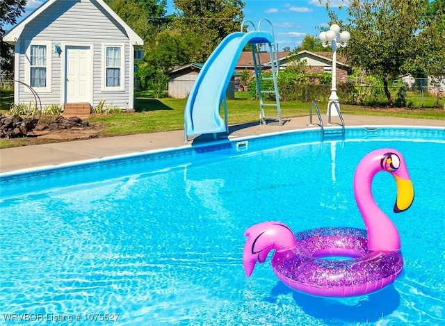 1414 12th Cir, Barling, AR 72923 - view of pool featuring a water slide and an outdoor structure