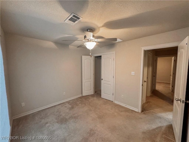 199 Pecan Ln, Greenwood, AR 72936 - unfurnished bedroom featuring a textured ceiling, a closet, visible vents, carpet floors, and baseboards