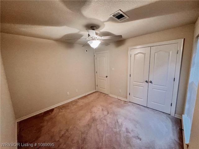 199 Pecan Ln, Greenwood, AR 72936 - unfurnished bedroom featuring baseboards, a closet, light carpet, a textured ceiling, and visible vents
