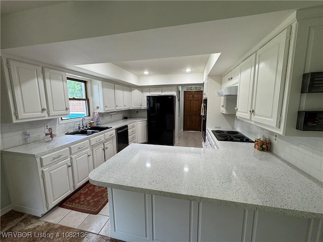 1721 Armistead Rd, Fort Smith, AR 72916 - kitchen featuring black appliances, a peninsula, tasteful backsplash, under cabinet range hood, and white cabinets