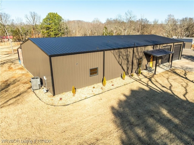 view of outbuilding featuring central air condition unit