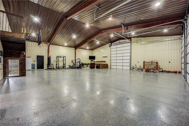 garage featuring wooden walls