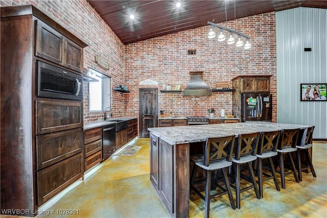 kitchen with dishwasher, a breakfast bar, light stone counters, a large island, and black fridge with ice dispenser