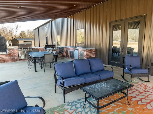 view of patio / terrace featuring area for grilling, an outdoor living space, and grilling area