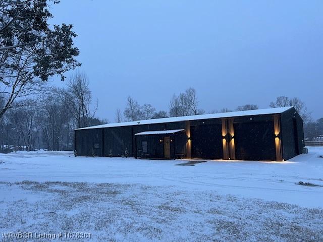 view of snow covered garage