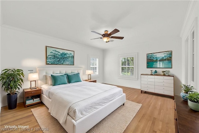 bedroom featuring light wood-type flooring and ceiling fan