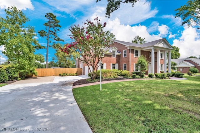 view of front facade featuring a front yard and a garage