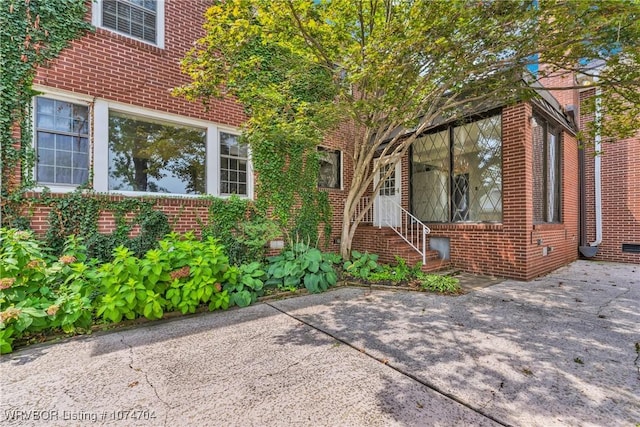 view of property exterior with a patio