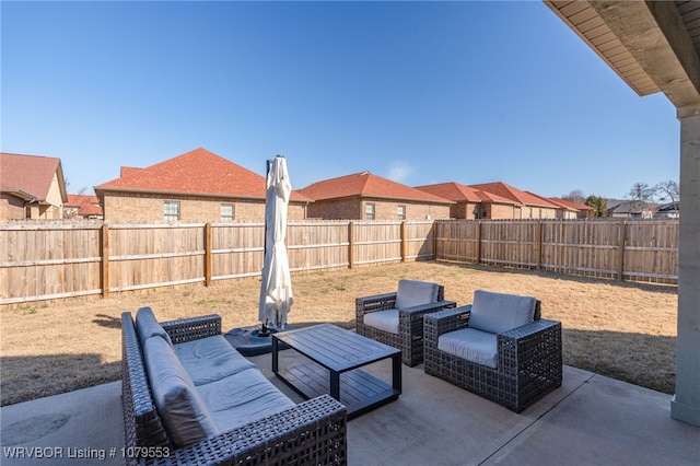 view of patio / terrace featuring an outdoor hangout area and a fenced backyard